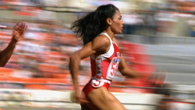 U.S. sprinter Florence Griffith Joyner of Los Angeles strides to...