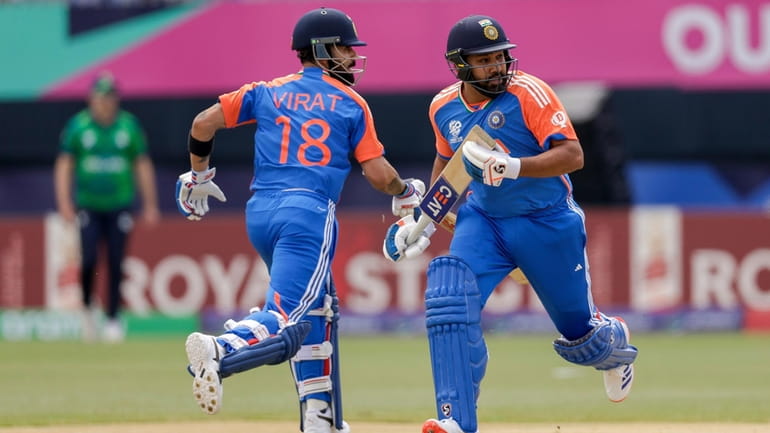 India's captain Rohit Sharma, right, and partner Virat Kohli run...