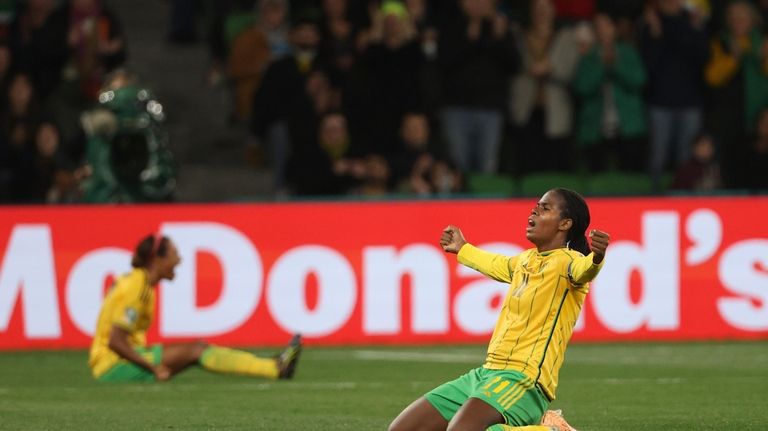 Jamaica's Khadija Shaw, right, celebrates after the Women's World Cup...