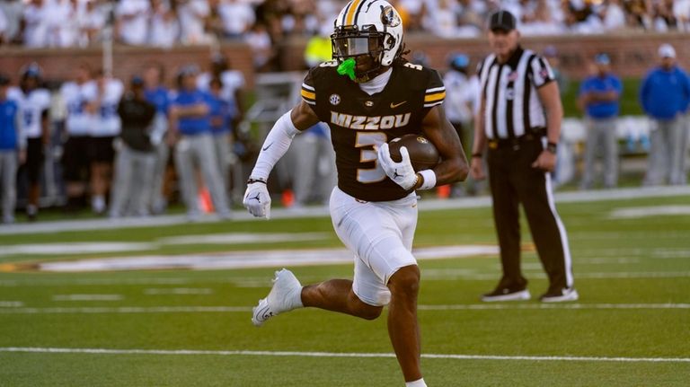 Missouri wide receiver Luther Burden III runs for a touchdown...