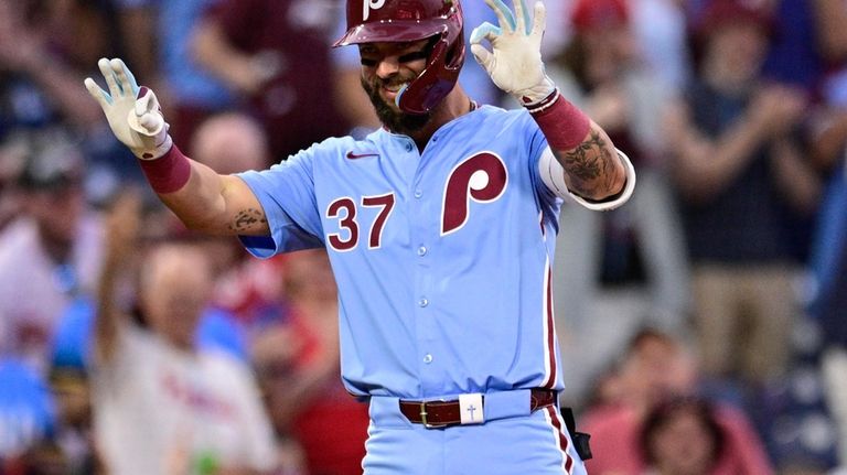 Philadelphia Phillies' Weston Wilson reacts after hitting a triple off...