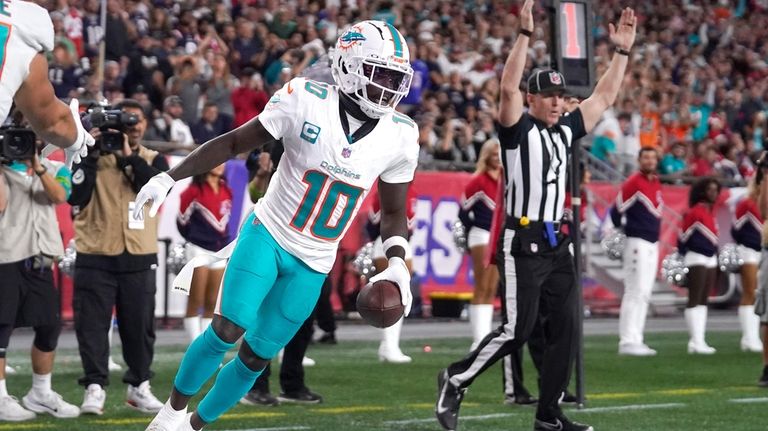 Miami Dolphins wide receiver Tyreek Hill (10) celebrates after his...