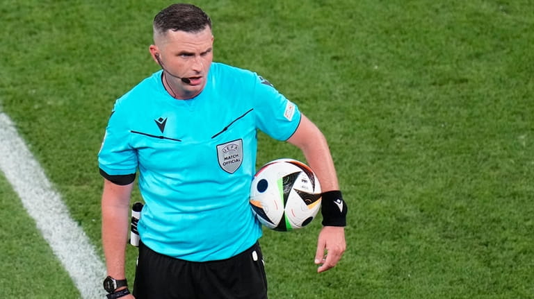 Referee Michael Oliver during a round of sixteen match between...