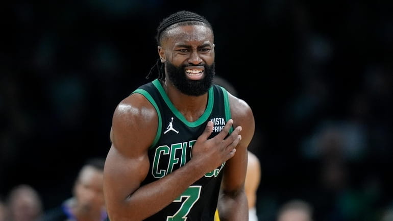 Boston Celtics guard Jaylen Brown (7) reacts on the court...