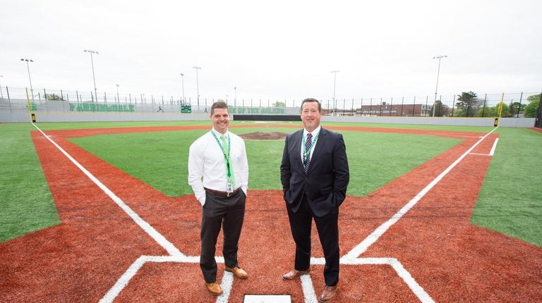 Farmingdale School District Superintendent Paul Defendini, left, and Assistant Superintendent...