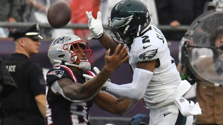 New England Patriots wide receiver Kendrick Bourne, front left, is...