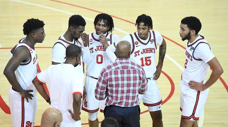 St. John's Red Storm head coach Mike Anderson directs his...