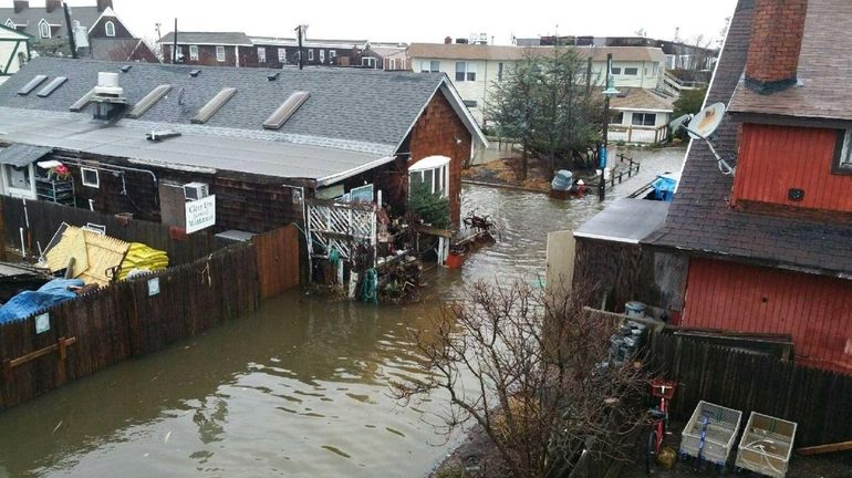 Flooding is seen at Ocean Beach on Fire Island on...