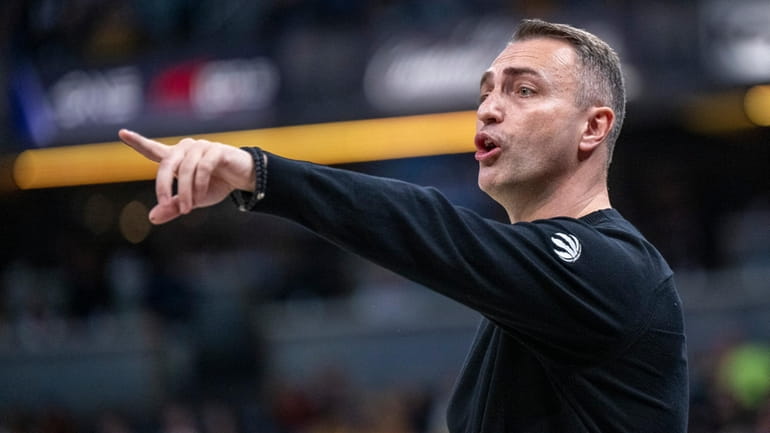 Toronto Raptors head coach Darko Rajakovic gestures during the first...