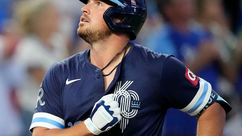 Kansas City Royals' Hunter Renfroe, right, celebrates after hitting a...