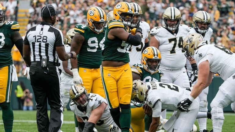 Green Bay Packers linebacker Rashan Gary reacts after sacking New...