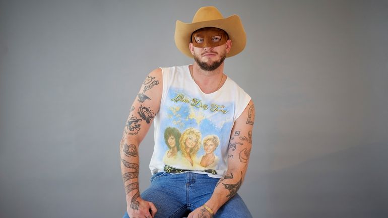 Country music artist Orville Peck poses for portraits on Wednesday,...