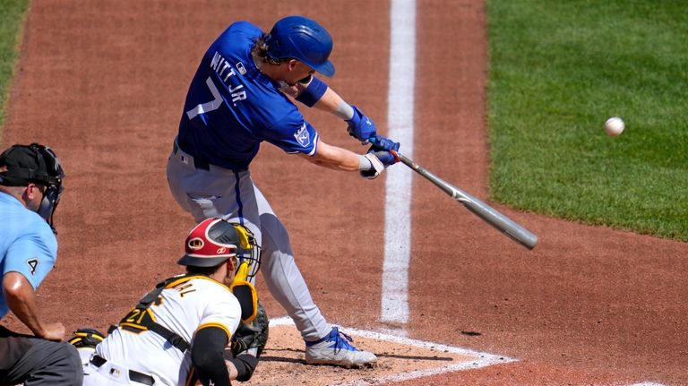 Kansas City Royals' Bobby Witt Jr. (7) hits a sacrifice...