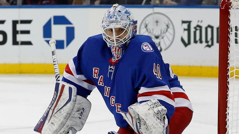Alexandar Georgiev of the Rangers defends the net during the second period...