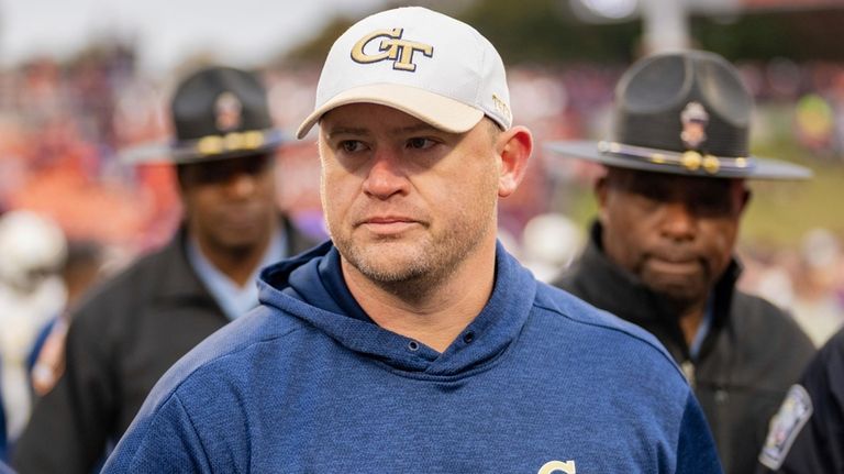 Georgia Tech head coach Brent Key walks off the field...