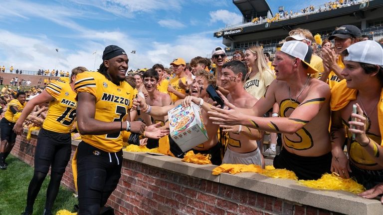 Missouri wide receiver Luther Burden III greets fans after defeating...