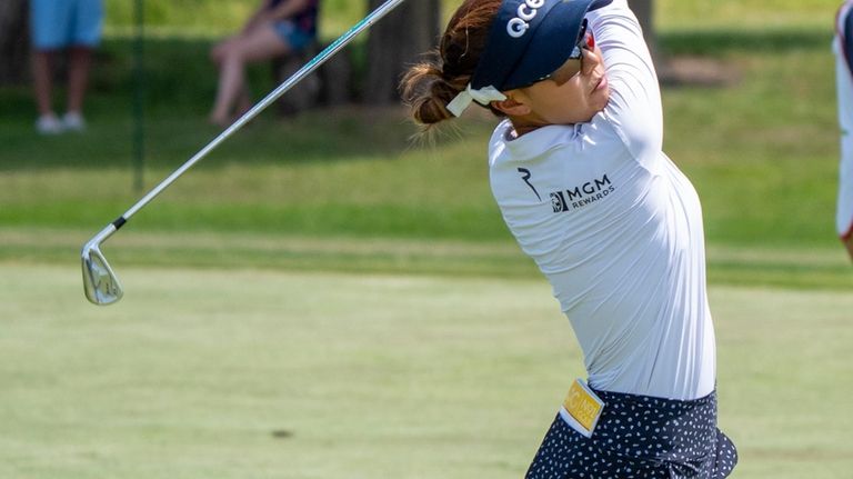 Jenny Shin, of South Korea, hits from the fairway on...