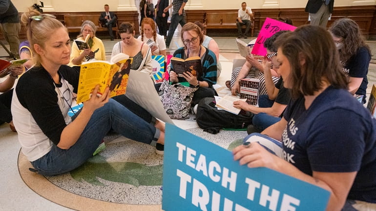 Protesters read books in the middle of the Texas Capitol...