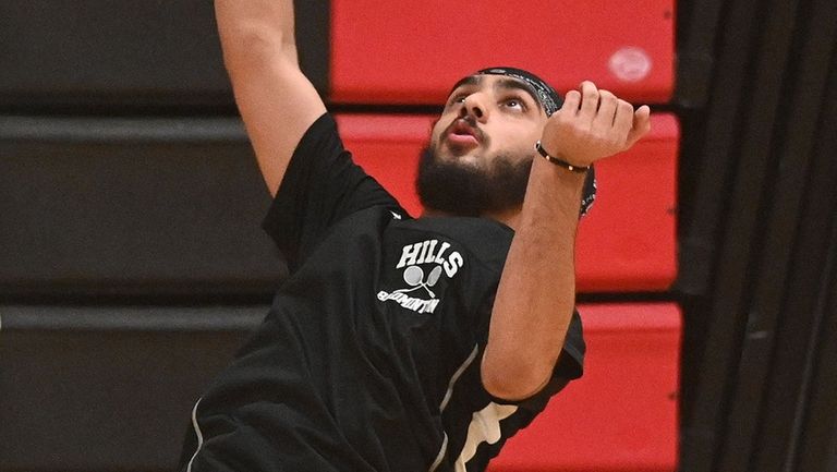 Rajveer Gujral of Half Hollow Hills returns a volley during...