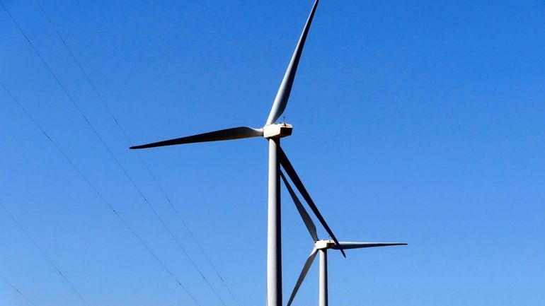 Land-based wind turbines spin in Atlantic City, N.J., April 28,...