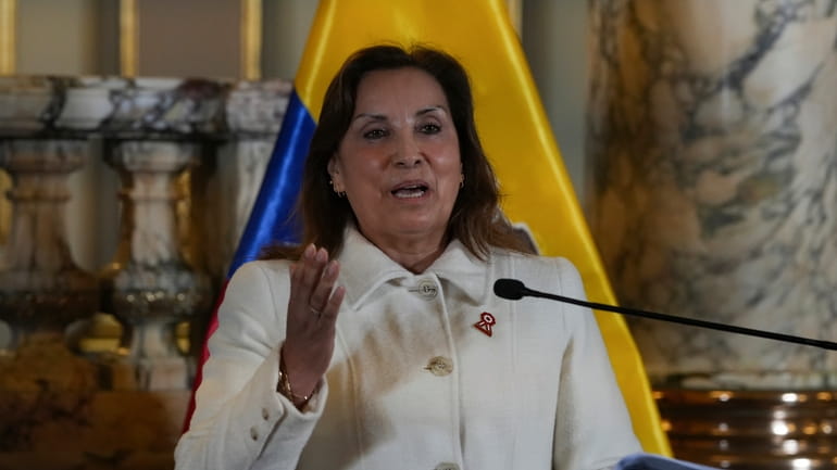 Peru's President Dina Boluarte gives a statement to the press...