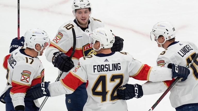 Florida Panthers' Evan Rodrigues (17) celebrates his goal against the...