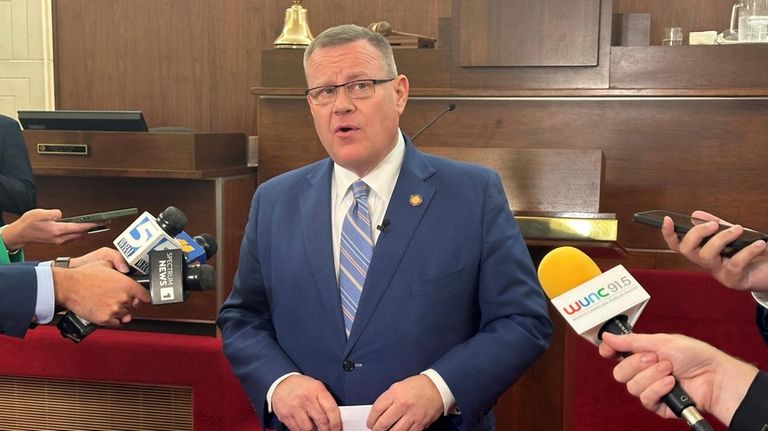 North Carolina House Speaker Tim Moore, R-Cleveland, speaks to reporters...