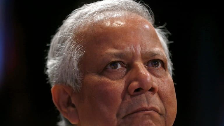 FILE- Nobel Peace Prize winner Muhammad Yunus listens to a...