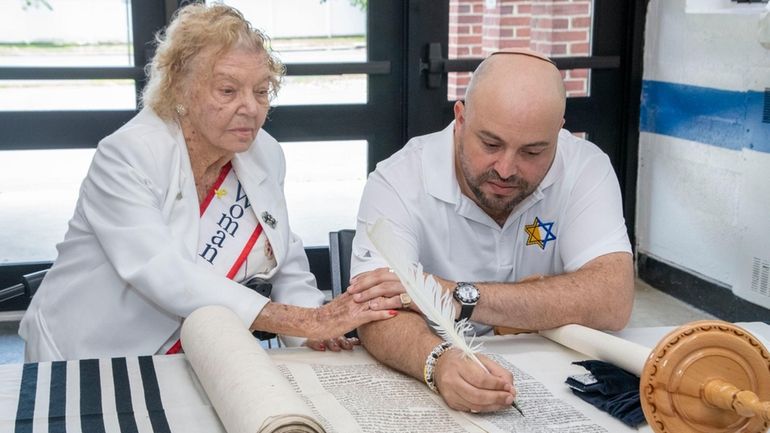 Holocaust survivor Lena Goren, 96, writes in "The Survivor Torah" on...