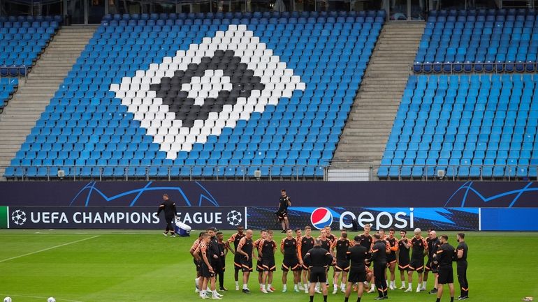 Shakhtar Donetsk's players and coaches gather for a training session...