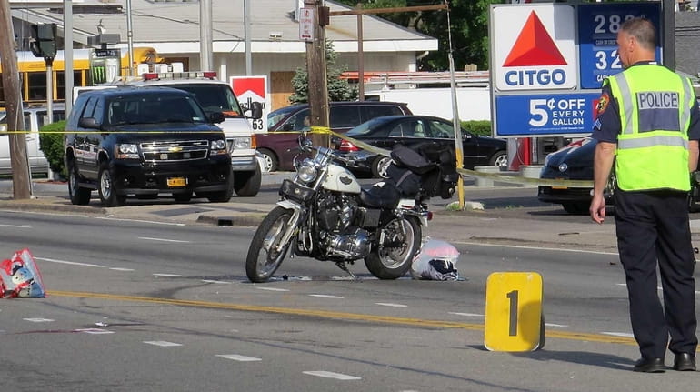 Nassau County police investigate the scene of an accident involving...