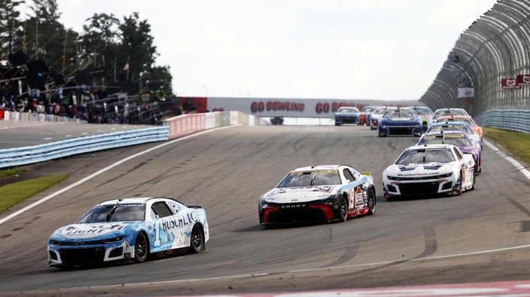 Ross Chastain (#1) drives into turn one during a NASCAR...