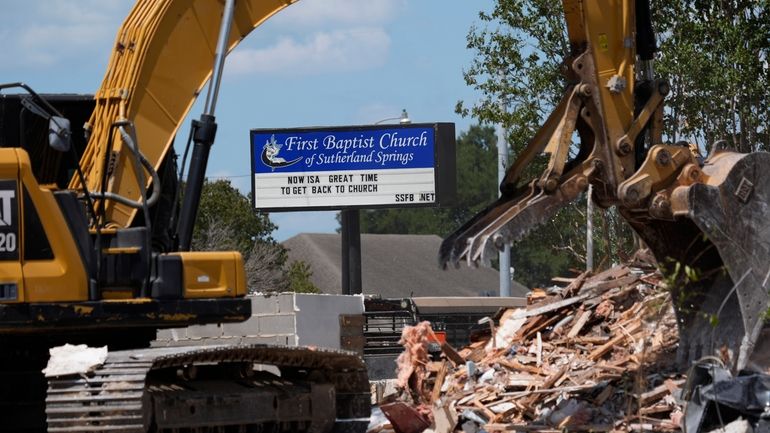 Workers continue demolition of the Sutherland Springs church where a...