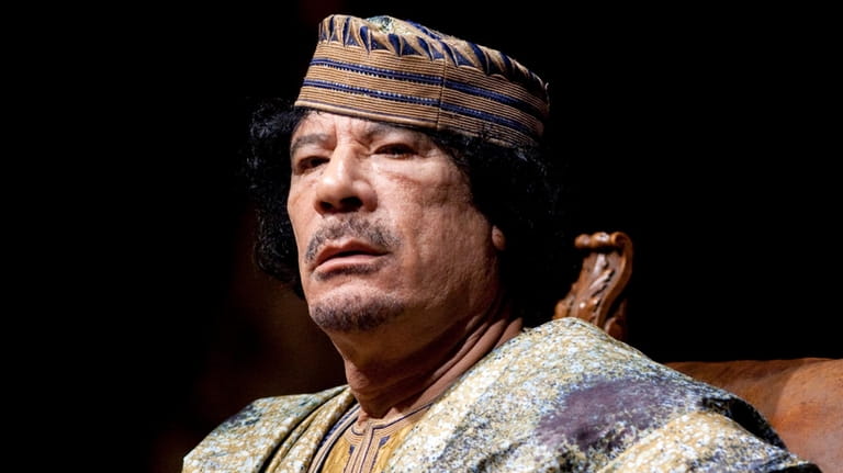 Libyan leader Muammar Gadhafi delivers his speech during a meeting...