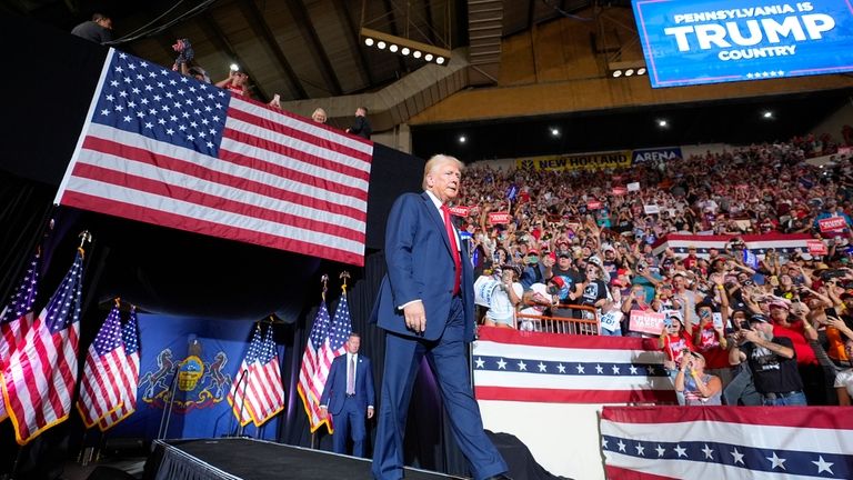 Republican presidential candidate former President Donald Trump arrives to speak...