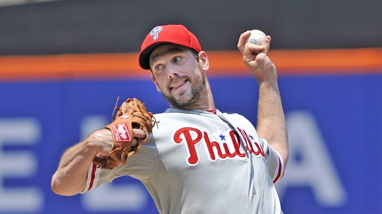 Cliff Lee delivers to the plate during a game against...