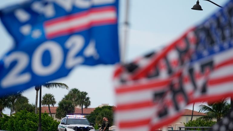 Police patrol on a bridge beside the Mar-a-Lago estate of...