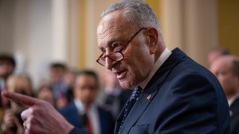 Senate Majority Leader Chuck Schumer, D-N.Y., answers questions on the...