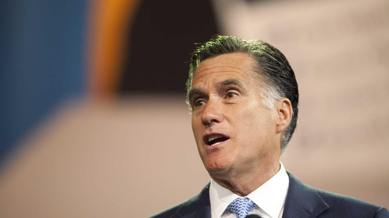 Republican presidential candidate and former Massachusetts Gov. Mitt Romney addresses...