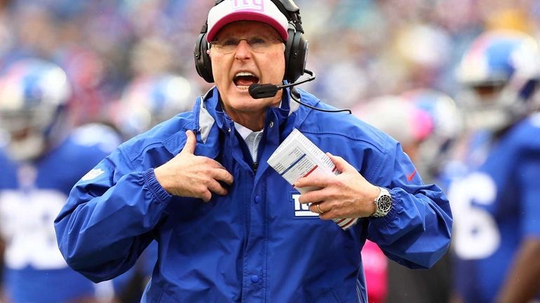 Head coach Tom Coughlin of the New York Giants reacts...