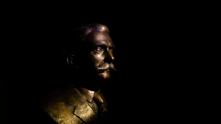 The bronze bust of the French Baron Pierre de Coubertin...