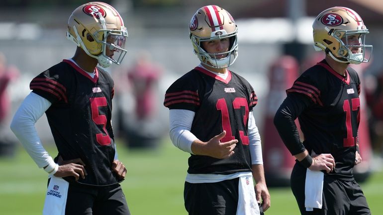 San Francisco 49ers quarterbacks Joshua Dobbs (5), Brock Purdy (13)...