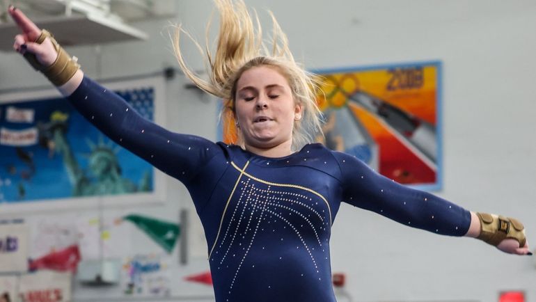 Jenna DeMarco of Massapequa competes in the floor exercise at...