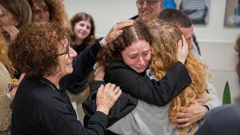 This photo released by the GPO, Meirav Tal, center right,...