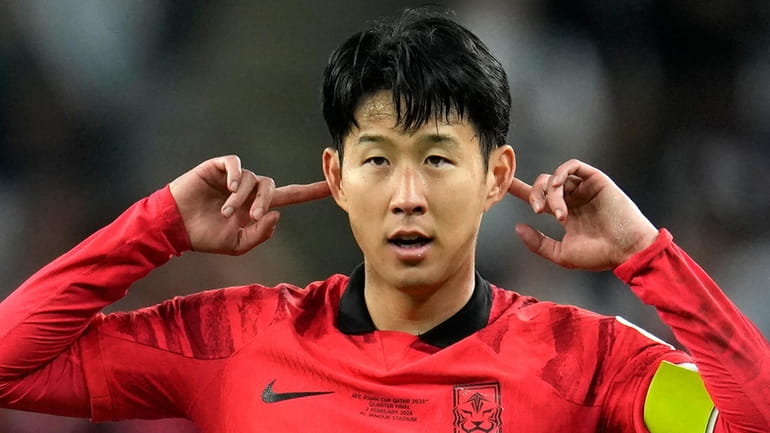 South Korea's Son Heung-min celebrates after scoring his side's second...