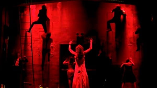 Molly Ranson, covered with blood-red light, in the revival of...