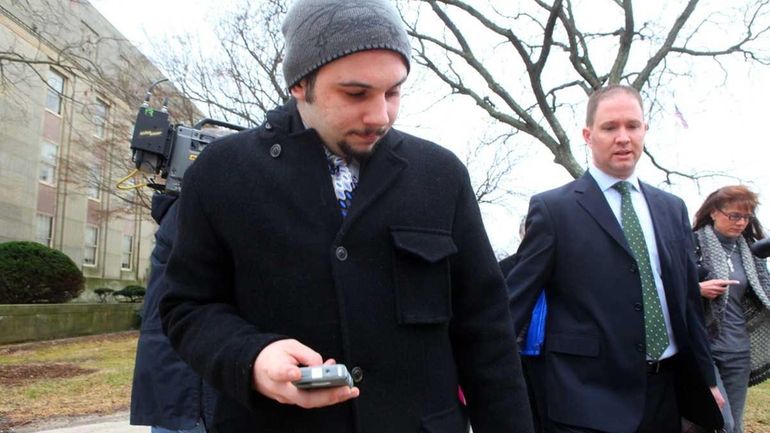 Zachary Parker, 20, of Merrick, leaves the Nassau County Court...