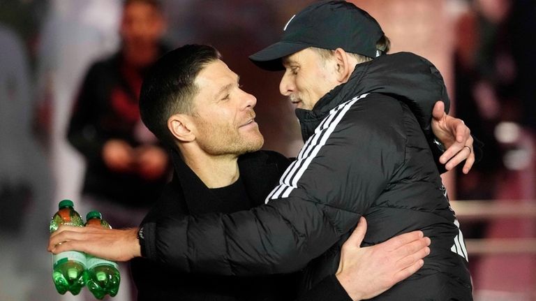 Bayern's head coach Thomas Tuchel, right, welcomes Leverkusen's head coach...