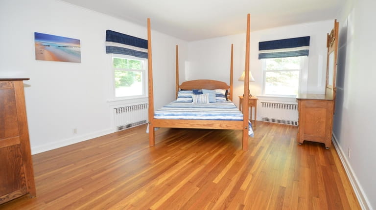 This two-bedroom, one-bath, 1,499-square-foot ranch in Southold, close to South...