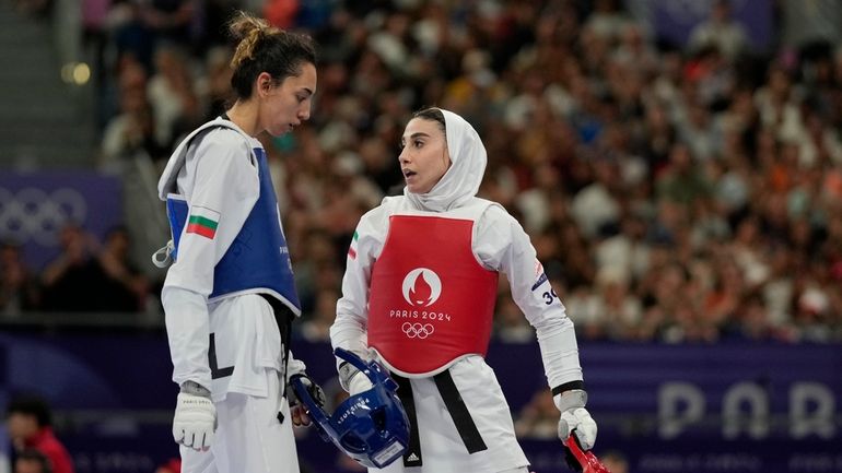 Iran's Nahid Kiyanichandeh, right, reacts at the end of a...